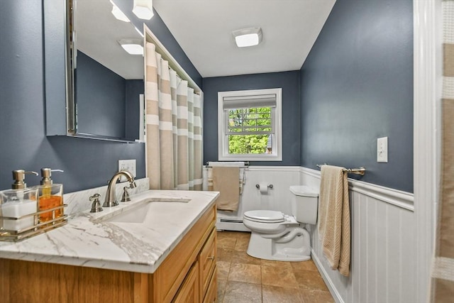 11 Fern Ave, Amesbury, MA 01913 - full bathroom with toilet, a baseboard radiator, vanity, a shower with shower curtain, and a wainscoted wall