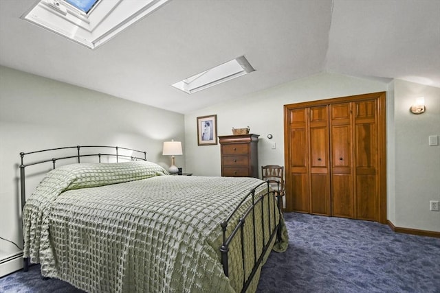 11 Fern Ave, Amesbury, MA 01913 - bedroom with a skylight, dark colored carpet, lofted ceiling, a baseboard heating unit, and a closet