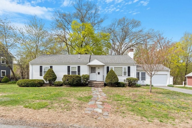 ranch-style house featuring a garage, a front lawn, aphalt driveway, and a chimney