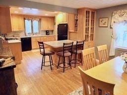 dining space featuring light wood-type flooring