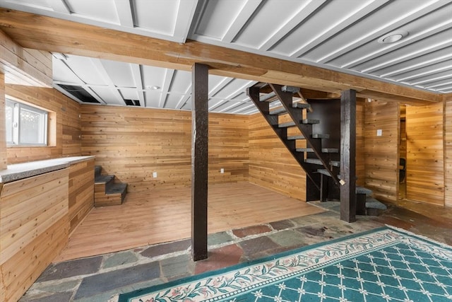 interior space featuring wood walls