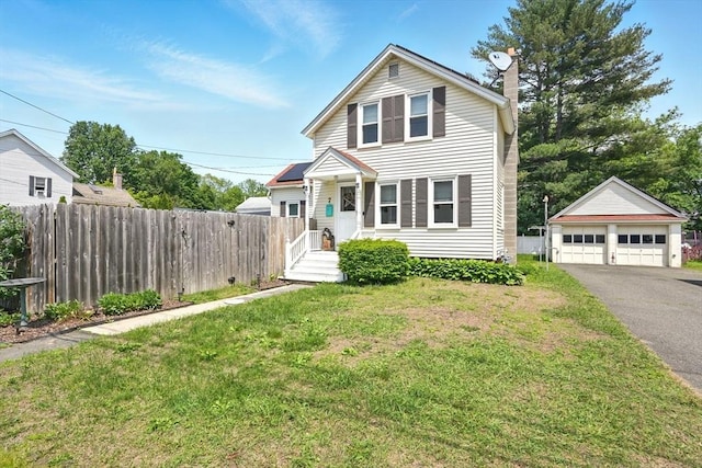 7 Gaston St, Easthampton, MA 01027 - traditional-style house featuring an outbuilding, a garage, and a chimney
