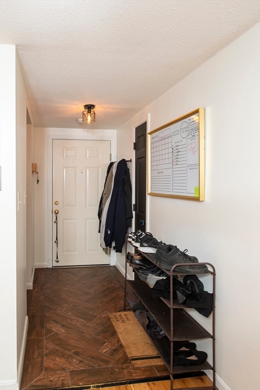 entrance foyer with a textured ceiling