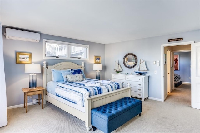 bedroom featuring a wall mounted air conditioner, baseboard heating, light carpet, and baseboards