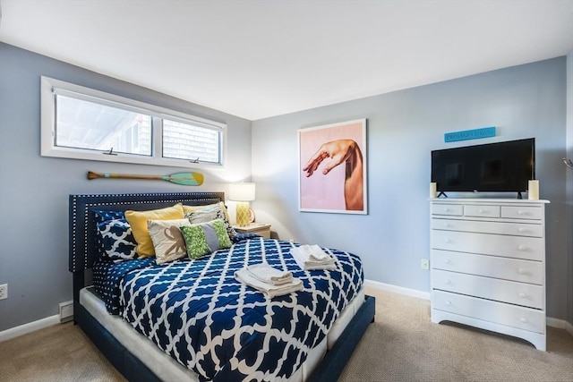 carpeted bedroom featuring baseboards