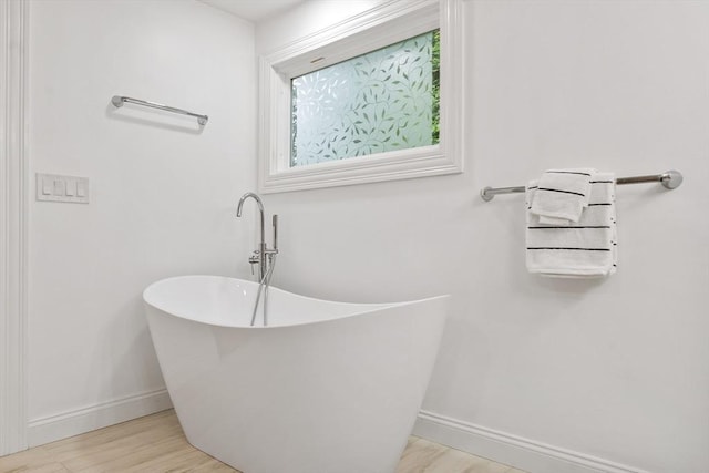 2028 Main St, Concord, MA 01742 - bathroom with a soaking tub and wood finished floors