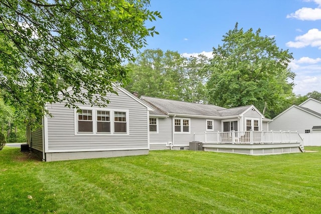 2028 Main St, Concord, MA 01742 - back of property featuring a wooden deck, a lawn, and a chimney