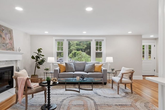 2028 Main St, Concord, MA 01742 - living area featuring a glass covered fireplace, light wood-type flooring, and recessed lighting
