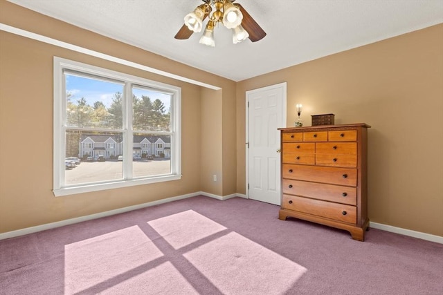 bedroom featuring carpet floors, baseboards, and ceiling fan