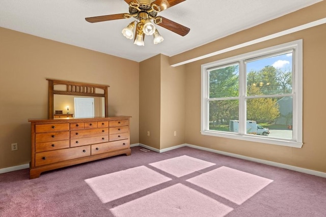 bedroom featuring a ceiling fan, baseboards, and carpet