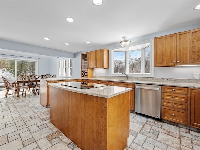 kitchen featuring a center island, black electric stovetop, stone tile flooring, stainless steel dishwasher, and a sink