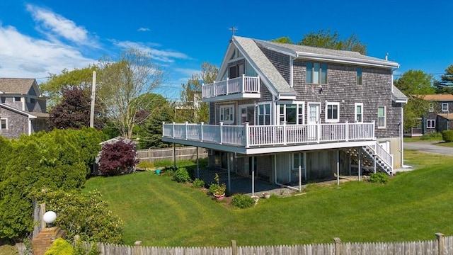 5 Bayview Ave, Fairhaven, MA 02719 - rear view of house featuring a balcony, a wooden deck, a shingled roof, and stairs