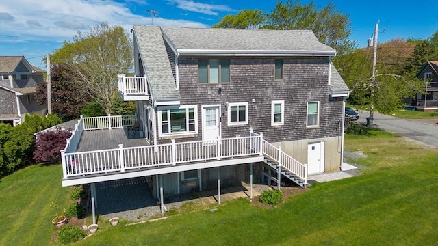 5 Bayview Ave, Fairhaven, MA 02719 - back of property with a balcony, a lawn, a wooden deck, and a shingled roof