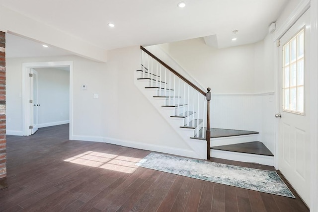 stairs with hardwood / wood-style flooring