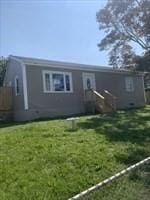 view of front of home featuring a front lawn