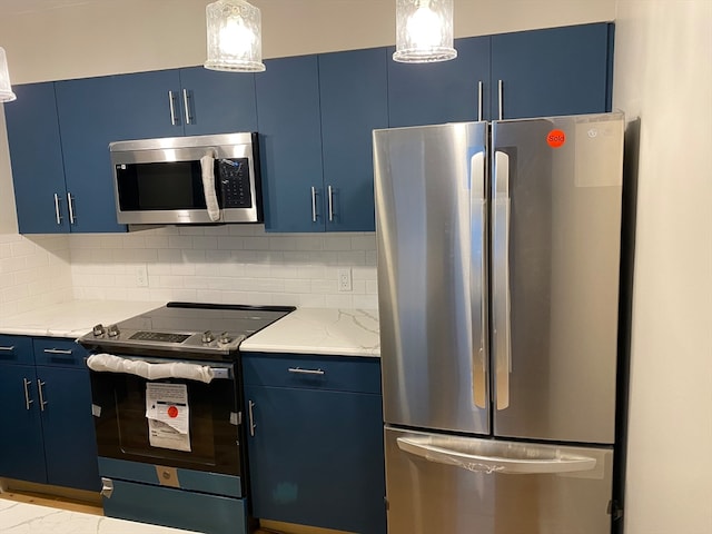 kitchen featuring appliances with stainless steel finishes, light stone countertops, tasteful backsplash, and blue cabinetry