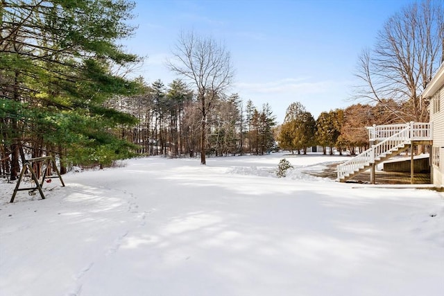 view of yard layered in snow