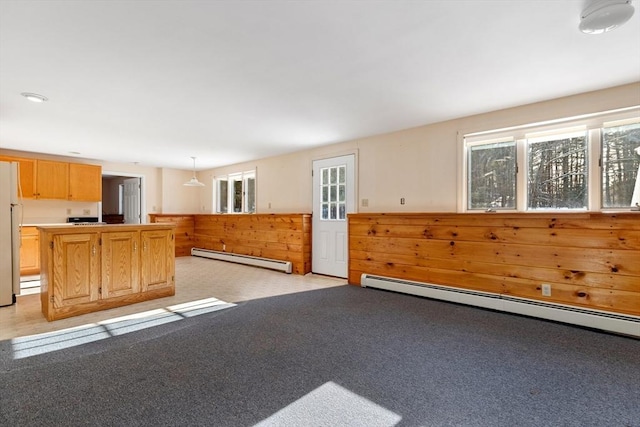 interior space featuring a baseboard radiator and light colored carpet