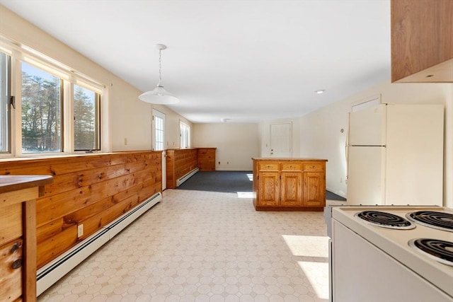 kitchen with hanging light fixtures, white appliances, and baseboard heating