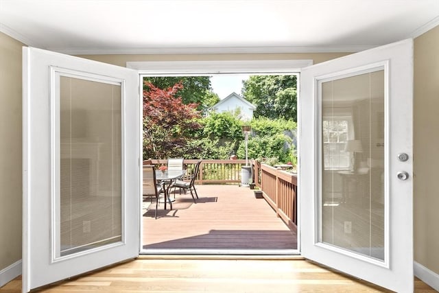 15 Maple St, Salem, MA 01970 - doorway to outside with ornamental molding and wood finished floors