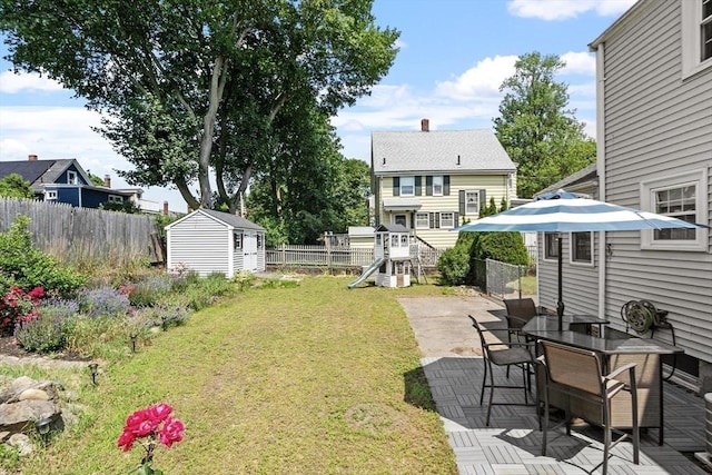 15 Maple St, Salem, MA 01970 - view of yard featuring a storage unit, a patio area, and a playground