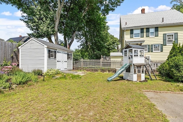 15 Maple St, Salem, MA 01970 - fenced backyard with a playground and an outbuilding