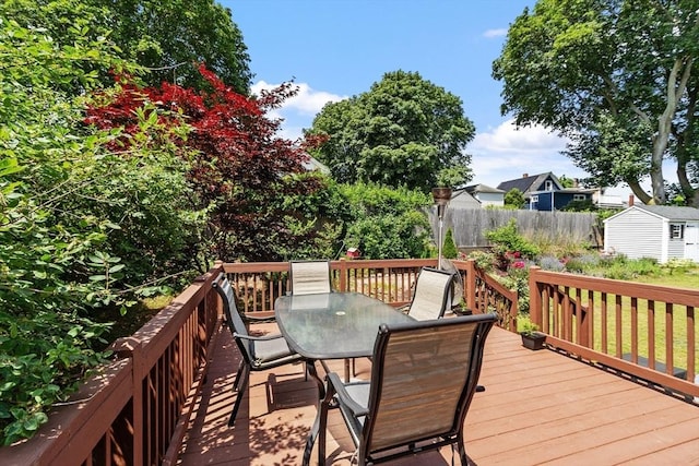15 Maple St, Salem, MA 01970 - deck with outdoor dining space and a shed