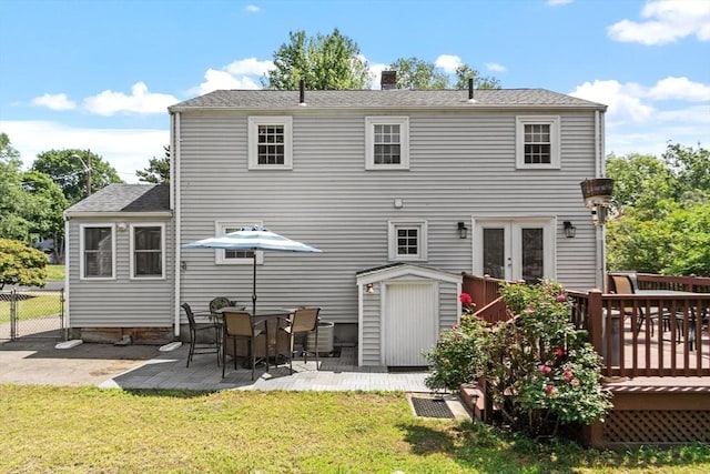 15 Maple St, Salem, MA 01970 - back of property with a deck, a chimney, french doors, and a patio