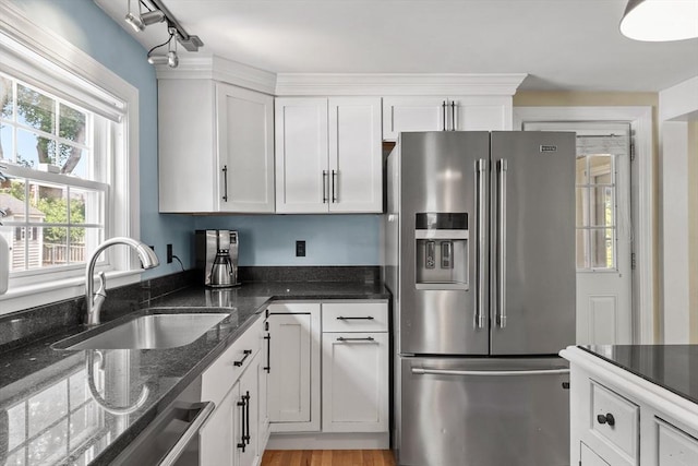 15 Maple St, Salem, MA 01970 - kitchen with appliances with stainless steel finishes, white cabinetry, and dark stone counters