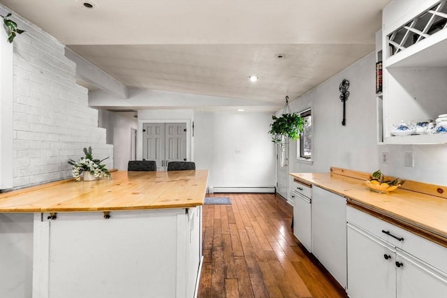 kitchen featuring wooden counters, open shelves, dark wood-style flooring, white cabinets, and a baseboard heating unit