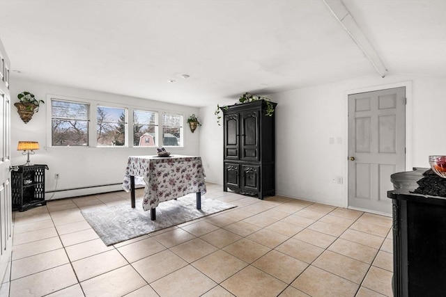 interior space featuring light tile patterned floors, baseboard heating, and vaulted ceiling with beams