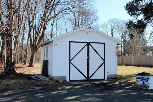 view of shed with fence