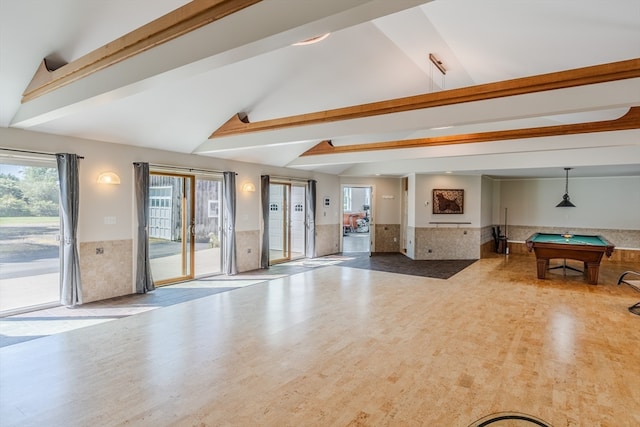 living room featuring pool table and vaulted ceiling with beams