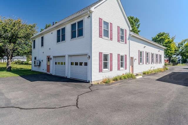 view of home's exterior with a garage