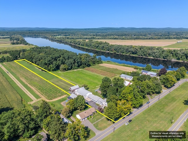 birds eye view of property featuring a water view and a rural view