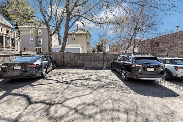 view of car parking with fence
