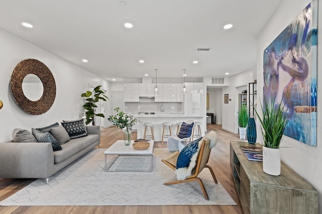 living room with light hardwood / wood-style floors