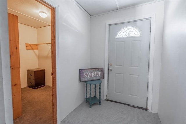 foyer with light colored carpet