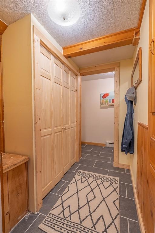 hallway featuring a baseboard radiator