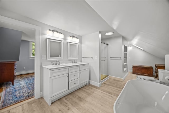 full bathroom featuring double vanity, shower with separate bathtub, a baseboard radiator, wood-type flooring, and vaulted ceiling