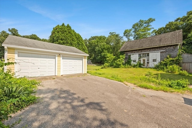 garage with a yard