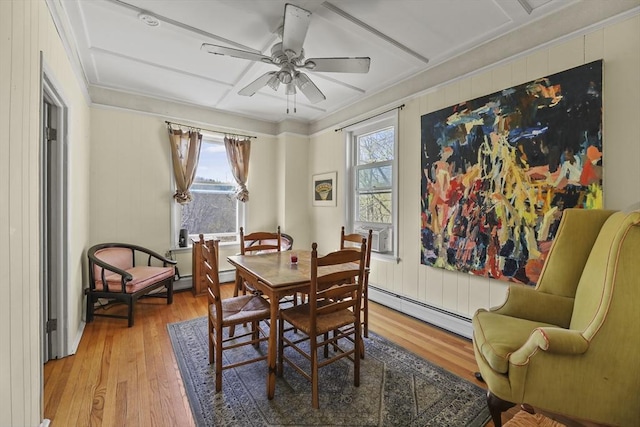132 E Quincy St, North Adams, MA 01247 - dining area featuring light wood-style floors, a baseboard heating unit, and a wealth of natural light