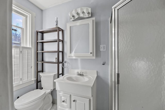 132 E Quincy St, North Adams, MA 01247 - bathroom with vanity, baseboards, a stall shower, and toilet