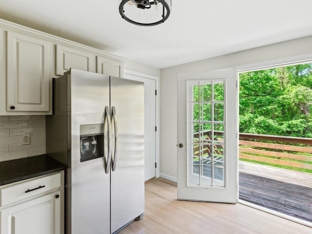 51 Old Stagecoach Rd, Attleboro, MA 02703 - kitchen with stainless steel fridge with ice dispenser, decorative backsplash, dark countertops, light wood finished floors, and baseboards