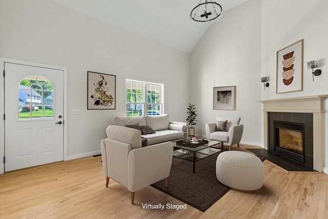 51 Old Stagecoach Rd, Attleboro, MA 02703 - living room with high vaulted ceiling, healthy amount of natural light, light wood-style floors, a fireplace, and baseboards
