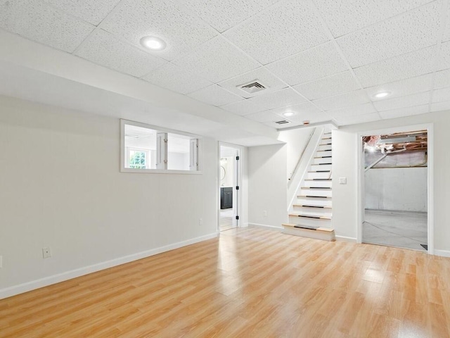 51 Old Stagecoach Rd, Attleboro, MA 02703 - basement featuring stairway, a paneled ceiling, light wood-style floors, baseboards, and recessed lighting