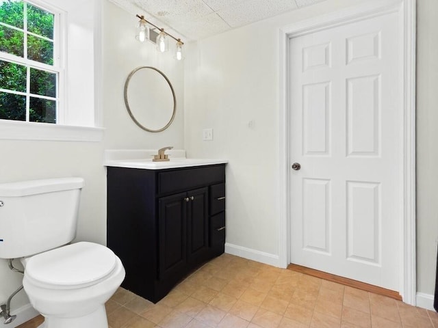 51 Old Stagecoach Rd, Attleboro, MA 02703 - bathroom featuring vanity, toilet, baseboards, and a paneled ceiling