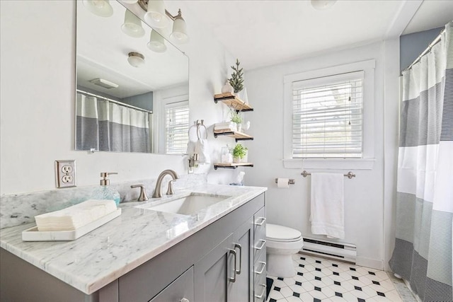 59 Brigantine Cir, Plymouth, MA 02360 - bathroom with a baseboard radiator, toilet, vanity, curtained shower, and baseboards