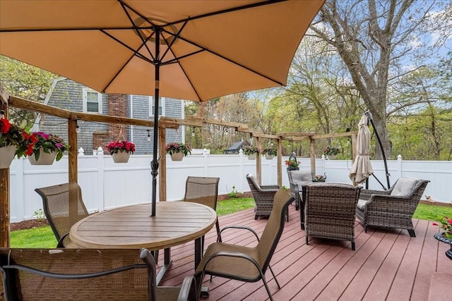 59 Brigantine Cir, Plymouth, MA 02360 - deck with outdoor dining area and a fenced backyard