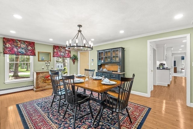 80 Christian Way, North Andover, MA 01845 - dining room featuring baseboard heating, light wood-style flooring, crown molding, a chandelier, and recessed lighting